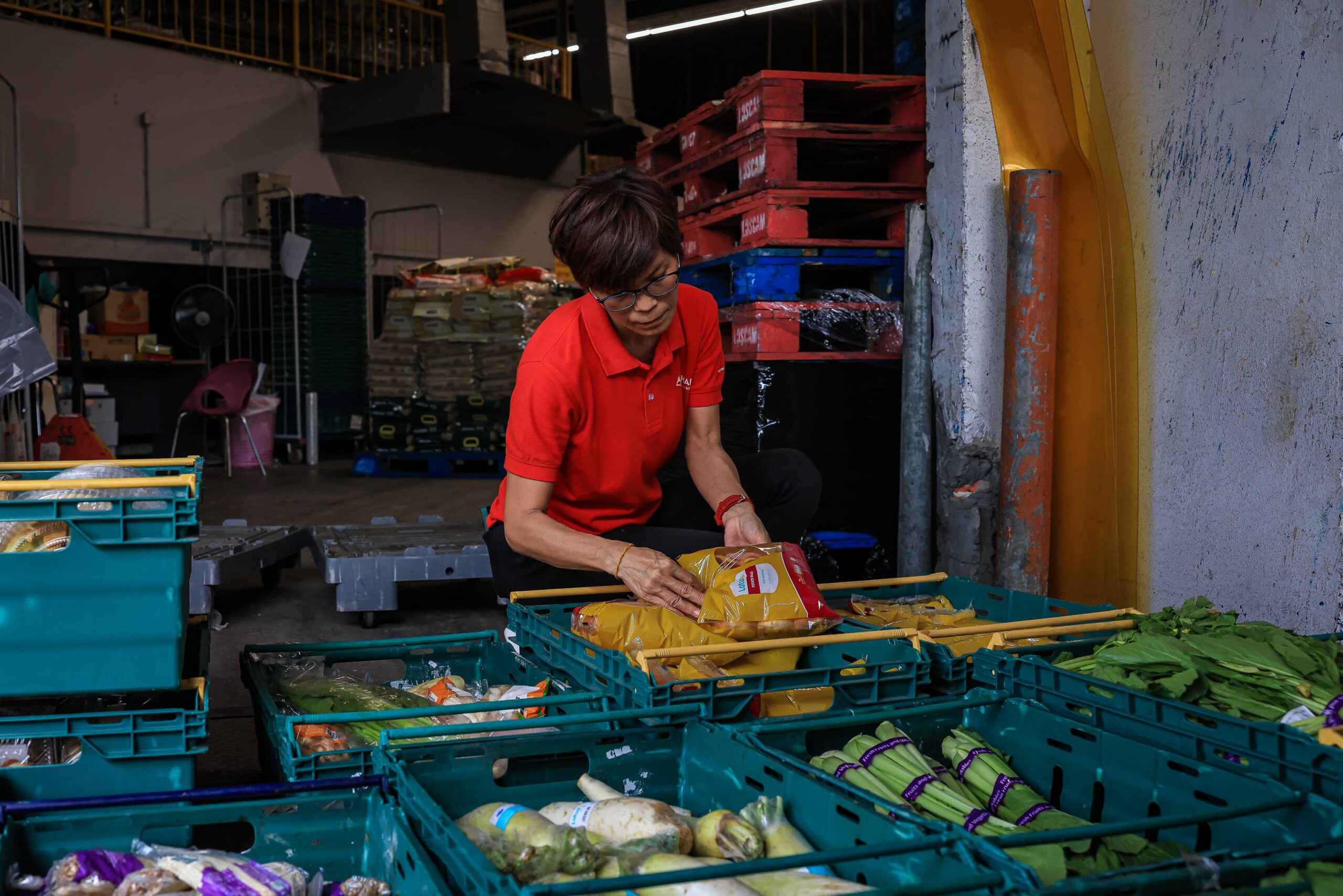 Kechara Soup Kitchen volunteers collect surplus vegetables and food from Lotus's Malaysia.
